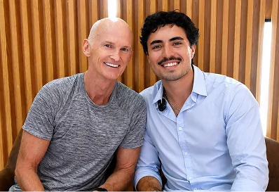 Two smiling men posing inside modern dental clinic in Puerto Vallarta.